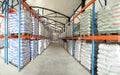 Large warehouses of sacks of animal feed. Veterinary production. Animal feed in stock. Pallets with cargo.