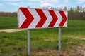 A large warning sign for a very sharp bend on a German country road