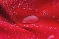Large water drop on red waterproof fabric Royalty Free Stock Photo