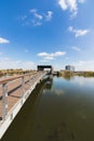 A large water pool with a wooden promenade on it, in the ecological park in Hod Hasharon