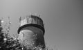 Large, concrete water tower with telecom and wireless 4G antennas. Royalty Free Stock Photo