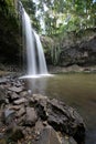 a large waterfall over a body of water near Byron Bay in Australia