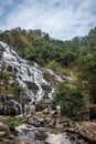 A large waterfall over a rocky cliff. Doi Inthanon National Park. Royalty Free Stock Photo