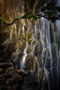 A large waterfall in the sun's rays tropical mysterious fairy jungle