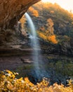 Large waterfall surrounded by vibrant fall foliage color. Kaaterskill Falls - Woodstock, NY