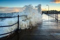 Large Wave breaks onto Amble Pier Royalty Free Stock Photo