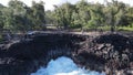 large wave crashing against lava cliffs at MacKenzie State Recreation Area, PAHOA, HAWAII