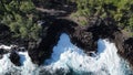 large wave crashing against lava cliffs at MacKenzie State Recreation Area, PAHOA, HAWAII