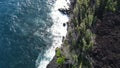 large wave crashing against lava cliffs at MacKenzie State Recreation Area, PAHOA, HAWAII