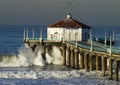 Large Wave Crashing into Manhattan Beach Pier Royalty Free Stock Photo