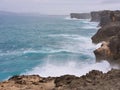 Large wave crashing onto sea cliff at Okinawa Royalty Free Stock Photo