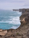 Large wave crashing onto sea cliff at Okinawa Royalty Free Stock Photo