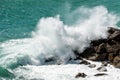 Large waves of the Sea Break on the Rocks - Breakwater in Liguria Italy Royalty Free Stock Photo