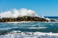 Large Waves of the Sea Break on the Rocks - Breakwater in Liguria Italy Royalty Free Stock Photo