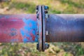 Large, weathered water pipe junction. Close up detail