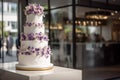 Large wedding cake on the table in the banquet hall.