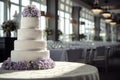 Large wedding cake on the table in the banquet hall.