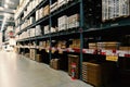 Large wharehouse with rows of shelves and goods boxes Royalty Free Stock Photo