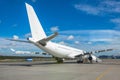 Large white aircraft parked at the airport, view of the tail. Royalty Free Stock Photo