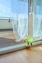 Large white aluminum door leading to a terrace on the attic floor of an urban home Royalty Free Stock Photo