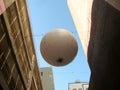 Large white ball hanging between the walls in Alley Oop. Vancouver BC, Canada