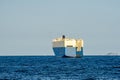 Large White and blue Roll-on/roll-off RORO or ro-ro ships or oceangoing vehicle carrier ship anchor in the open sea. Roro ship