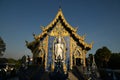 A large white Buddha image in the forbidding posture at The back of the beauty blue chapel of Wat Rong Suea Ten temple