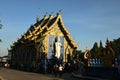 A large white Buddha image in the forbidding posture at The back of the beauty blue chapel of Wat Rong Suea Ten temple