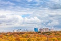 Large white clouds in blue sky over yellow park Royalty Free Stock Photo