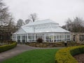 Large white conservatory cafe in park