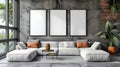 Large white couch and three blank frames for wall art mock up in living room with textured grey walls. Royalty Free Stock Photo