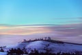 Large white domes of the weather station on the mountain against the backdrop of a colorful evening sky in the clouds. Royalty Free Stock Photo