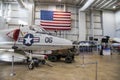 A large white fighter jet surrounded by flags at USS Alabama Battleship Memorial Park in Mobile Alabama