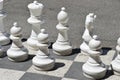 Large white figurines of chess game