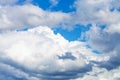 Large white and gray clouds in blue sky