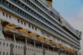 Large cruise tourist ship with yellow rescue boats Royalty Free Stock Photo