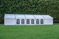 Large white marquee tent on lawn