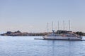 Large white 5-masted Caravella in the bay of Corfu port with New and Old Fortresses Royalty Free Stock Photo