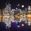 Large white moon rising behind Sydney CBD buildings NSW Australia Royalty Free Stock Photo