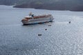 Large white passenger cruise liner in the old port of the Greek city of Fira. Royalty Free Stock Photo