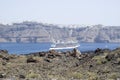 Large white passenger ship between the islands of Santorini and Royalty Free Stock Photo