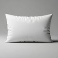 A large white pillow resting against a plain gray background Royalty Free Stock Photo