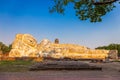 Large white reclining Buddha statue at Wat Lokayasutharam. Ayutthaya Historical Park, Thailand