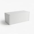 A large white rectangular box sitting on a white surface with a slight shadow Royalty Free Stock Photo
