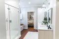 Large white renovated master bathroom with red brick floors Royalty Free Stock Photo