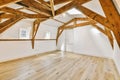 a large white room with exposed beams and wood floors Royalty Free Stock Photo