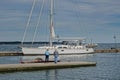 Large white Sailboat docked on York River