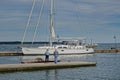 Large white Sailboat docked on York River