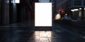 A large white sign is on a sidewalk in the middle of the night. The sign is empty and the street is Royalty Free Stock Photo