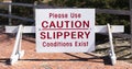 Please use caution slippery conditions exist sign